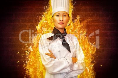 Composite image of portrait of confident female cook in kitchen