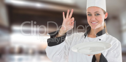 Composite image of portrait of a satisfying chef and holding an empty plate