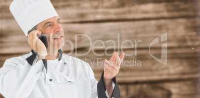 Composite image of chef calling on the phone