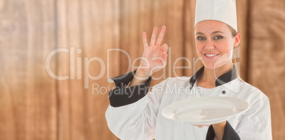 Composite image of portrait of a satisfying chef and holding an empty plate