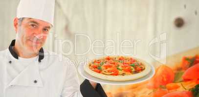 Composite image of friendly chef holding a pizza