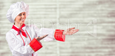 Composite image of pretty chef presenting with hands