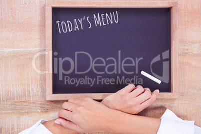 Composite image of hight angle of hand chef with blackboard