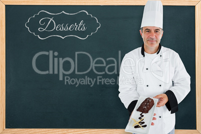 Composite image of portrait of a chef presenting a chocolate cakes
