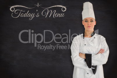 Composite image of a serious chef crossed arms