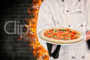 Composite image of male chef offering pizza