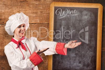 Composite image of pretty chef presenting with hands
