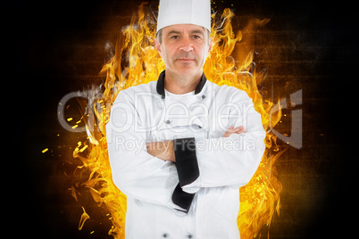 Composite image of serious chef crossed arms