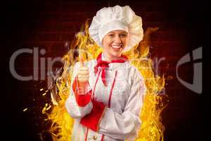 Composite image of pretty chef showing thumbs up