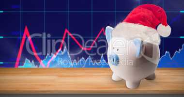 Composite image of image of a money-box with christmas hat