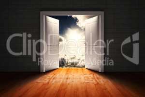 Composite image of door opening in dark room to show sky