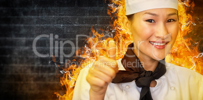 Composite image of portrait of smiling female cook gesturing thumbs up