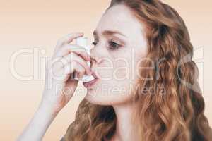 Composite image of close-up of woman using the asthma inhaler