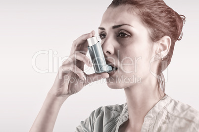 Composite image of portrait of a asthmatic woman