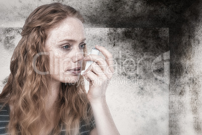 Composite image of beautiful woman using the asthma inhaler