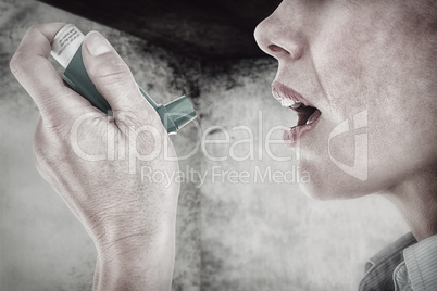 Composite image of close up of a woman using an asthma inhaler