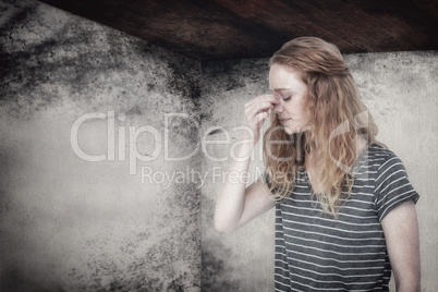 Composite image of blonde woman with headache pinching her nose