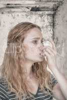 Composite image of woman using the asthma inhaler