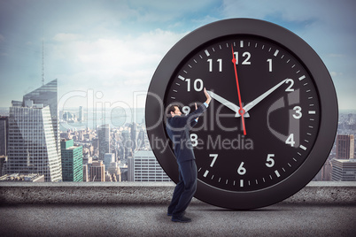Composite image of focused businessman pushing with hands