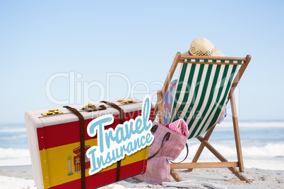 Composite image of travel insurance message on a spanish suitcase