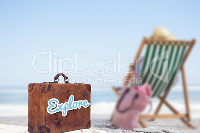 Composite image of explore message on a old suitcase