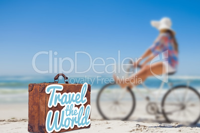 Composite image of travel the world message on an old suitcase