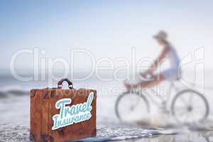 Composite image of travel insurance message on an old suitcase