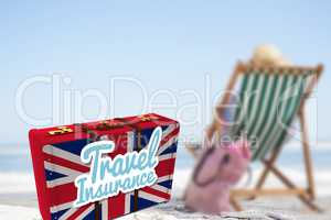 Composite image of travel insurance message on a british suitcase