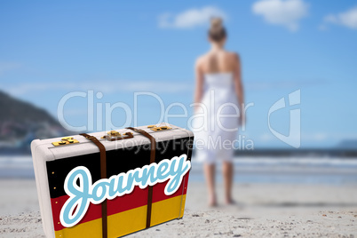 Composite image of blonde in white dress walking on the beach