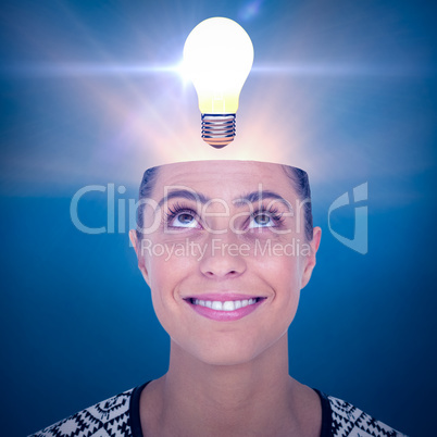 Composite image of beautiful woman looking up over white background