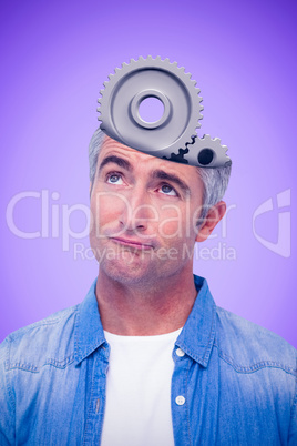 Composite image of confused man with grey hair thinking