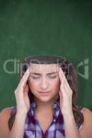 Composite image of upset woman suffering from headache