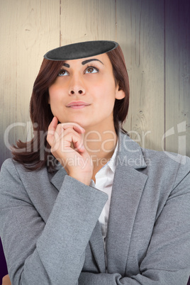 Composite image of focused businesswoman