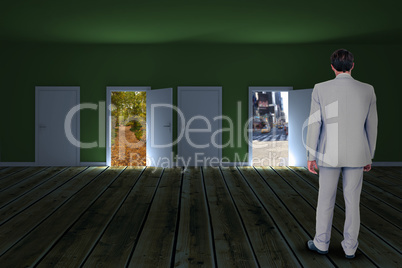 Composite image of rear view of businessman walking on white background