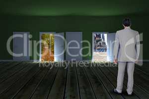 Composite image of rear view of businessman walking on white background