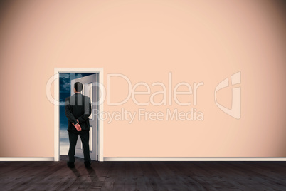 Composite image of rear view of classy businessman posing