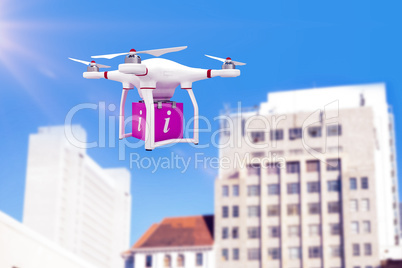 Composite image of a drone bringing a pink cube