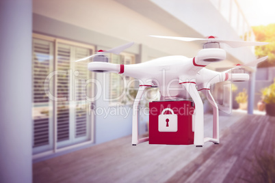 Composite image of a drone bringing a red cube