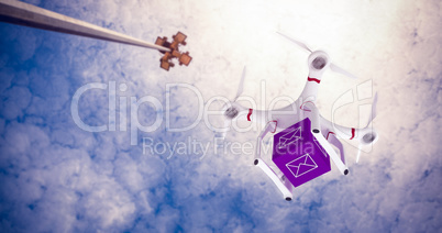 Composite image of a drone bringing a purple cube