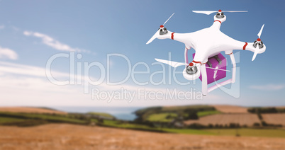 Composite image of a drone bringing a pink cube