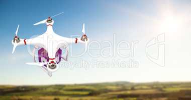 Composite image of a drone bringing a purple cube