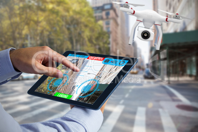 Composite image of man using tablet pc