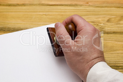 Wooden stamp in hand