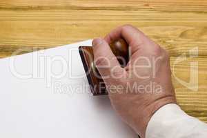 Wooden stamp in hand