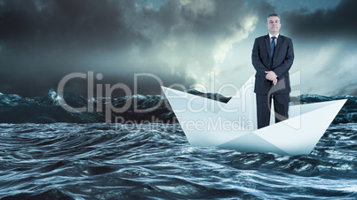 Composite image of mature businessman looking at camera