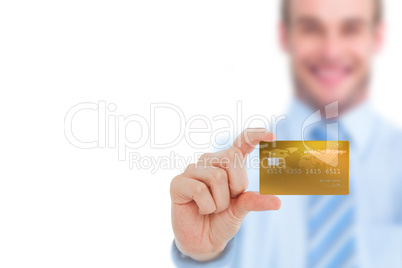 Happy businessman showing a creditcard