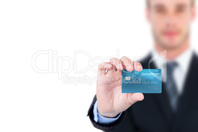 Businessman showing a credicard