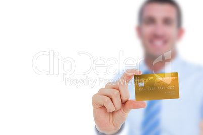 Happy businessman showing a creditcard