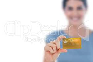 Happy businesswoman showing a creditcard