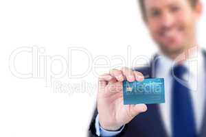 Happy businessman showing a creditcard